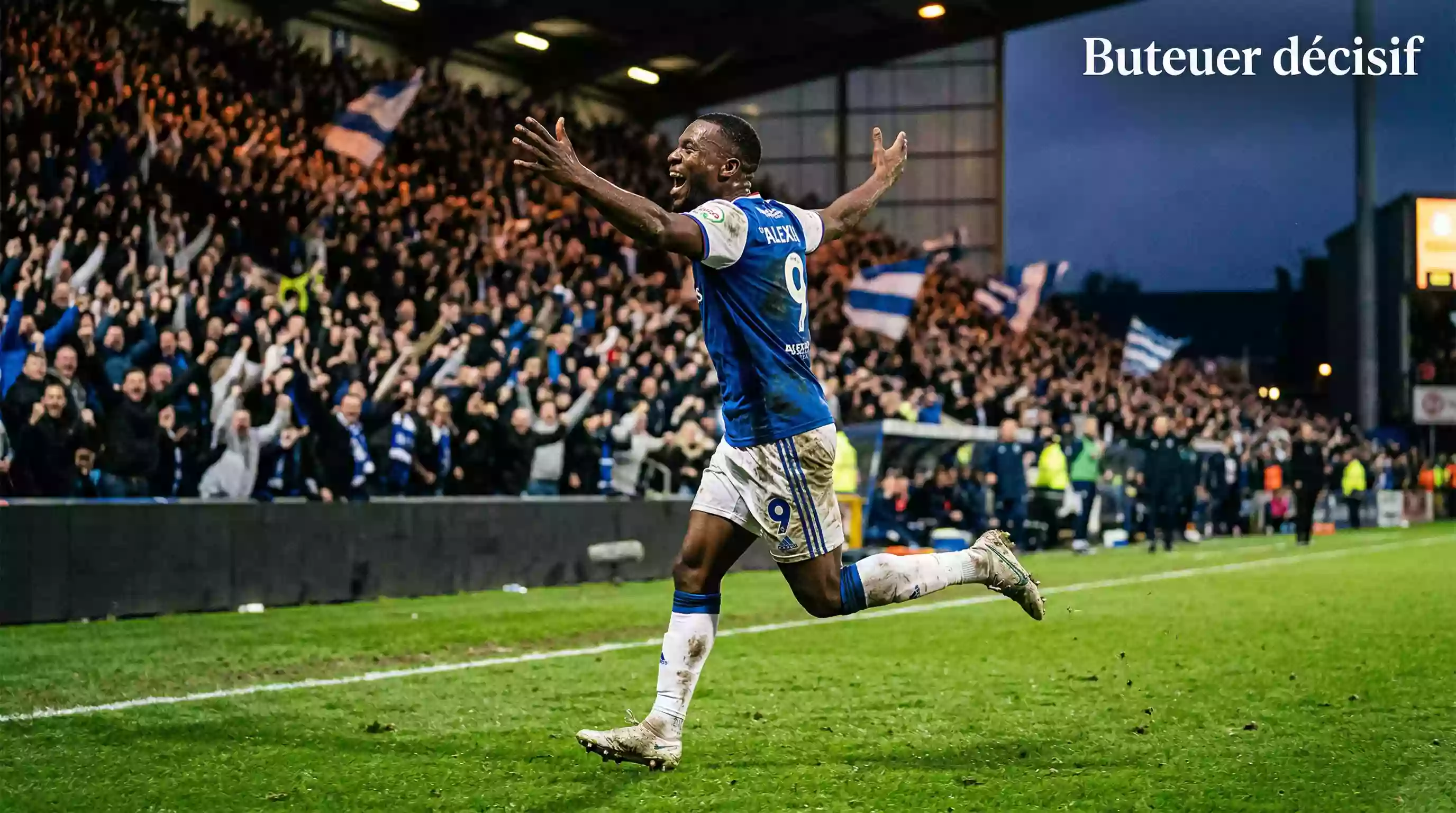 Attaquant célébrant un but avec passion devant les supporters dans un stade de football